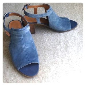 Denim blue suede open toed slingback shoes.
